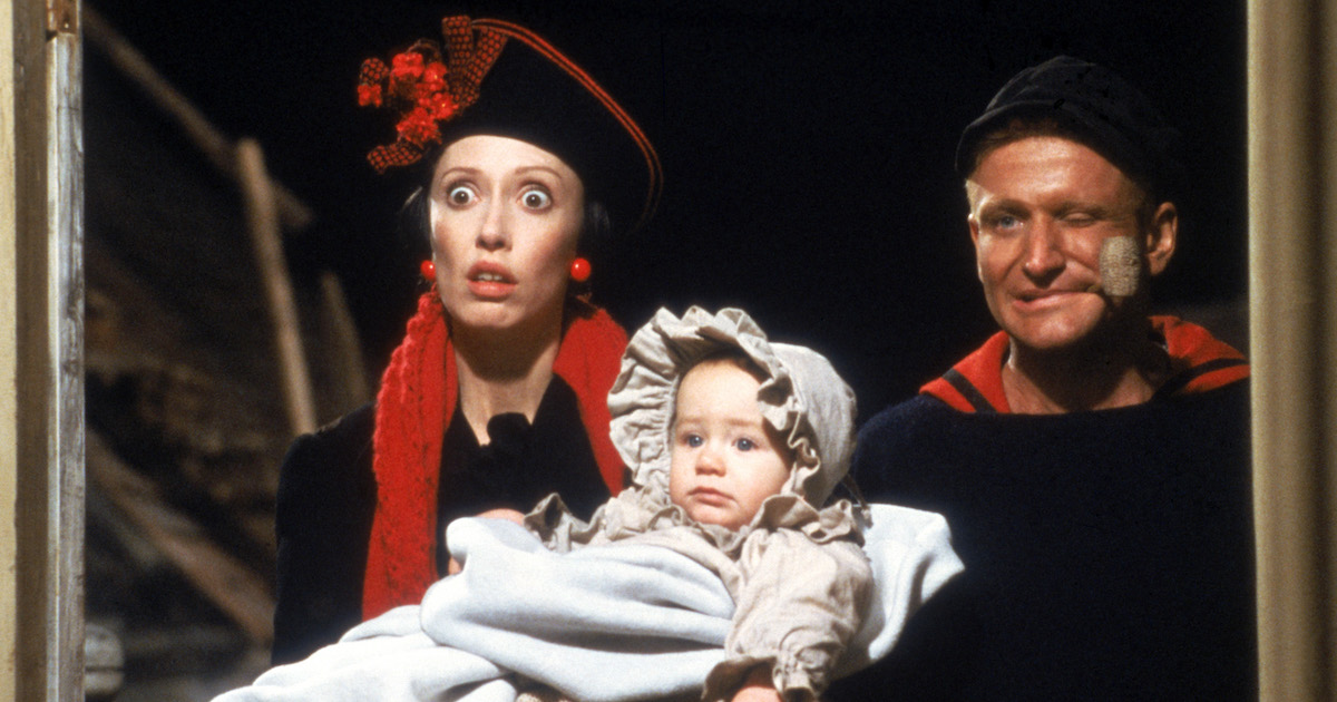 Shelley Duval and Robin Williams as Olive Oyl and Popeye, with their baby Sweapea in Robert Altman's Popeye