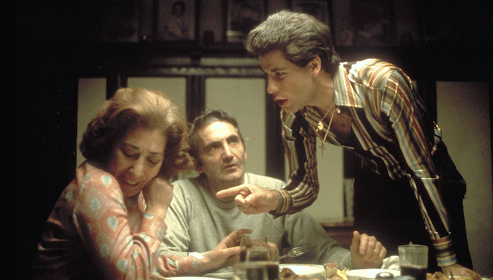 Tony Manero (John Travolta) argues with his parents at their dinner table in Saturday Night Fever