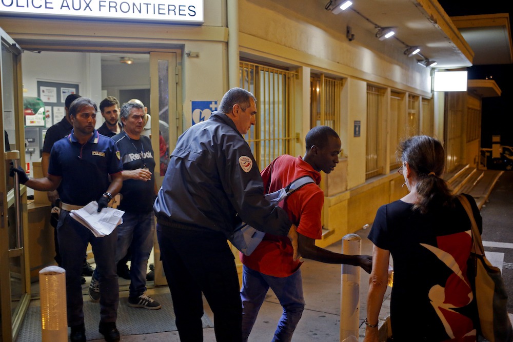 A Black person is detained at a French border post