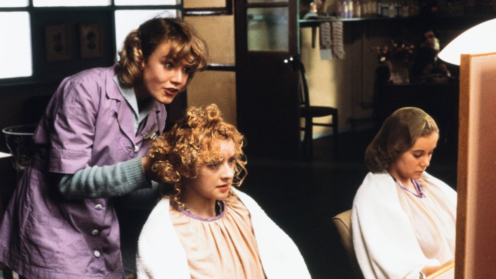 Emily Lloyd works as a hair dresser in Wish You Were Here