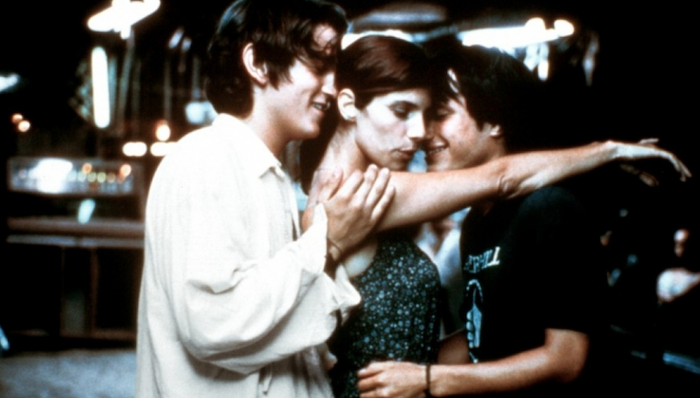 Diego Luna, Gael García Bernal, and Maribel Verdú dance in a close, sexual embrace in Y Tu Mamá También