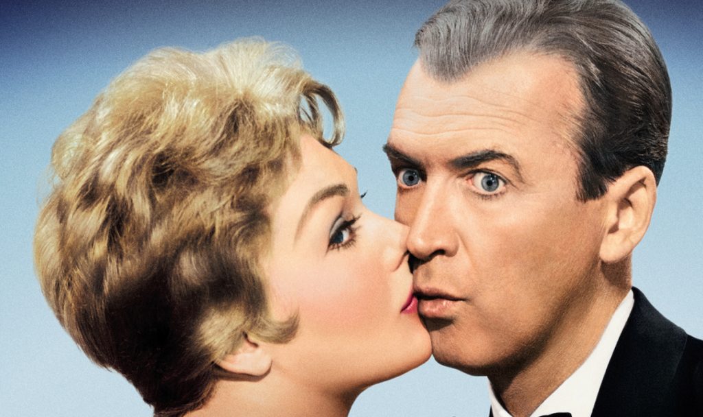 Kim Novak kisses Jimmy Stewart in Bell Book and Candle