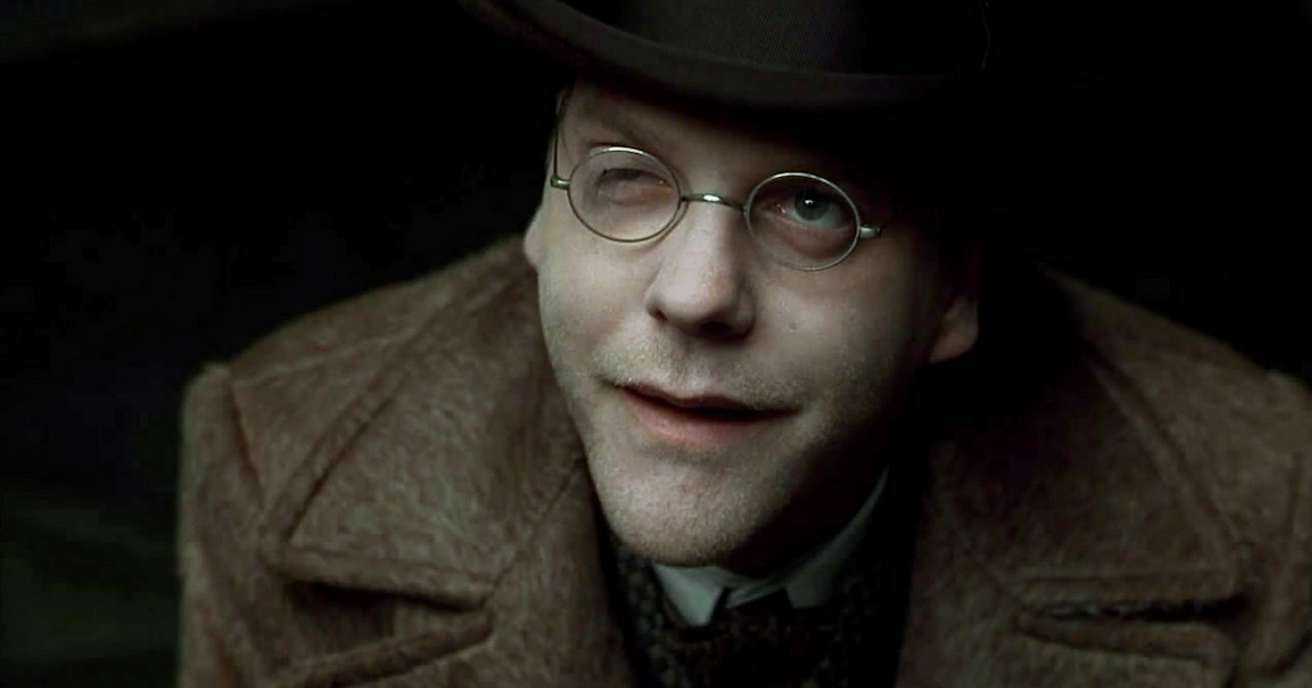 Close up of a smirking Dr. Schreber (Kiefer Sutherland) in Dark City