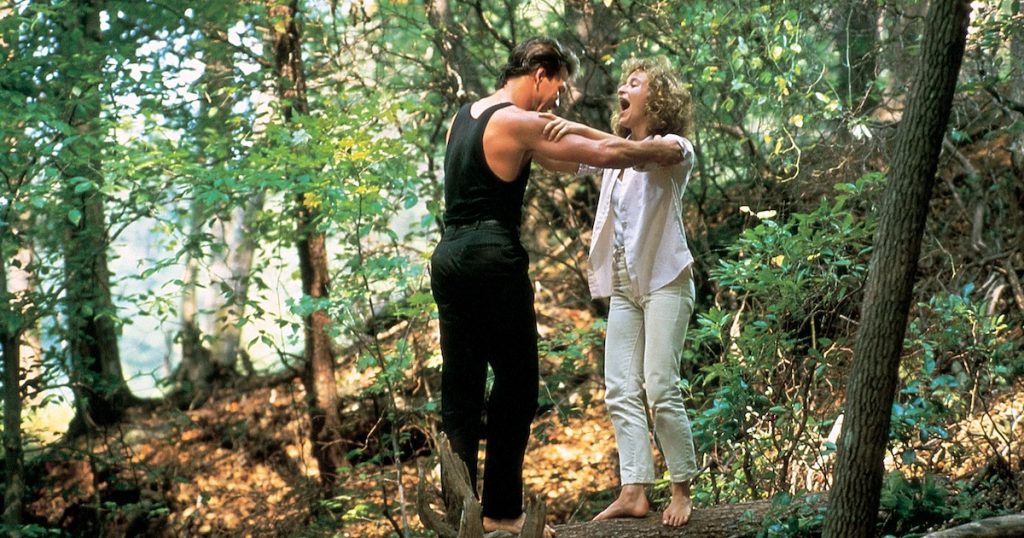 Patrick Swayze and Jennifer Grey practice dancing on a log in the woods in Dirty Dancing