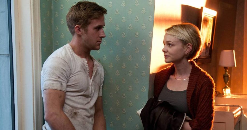 Ryan Gosling (in an oil-stained shirt) and Carry Mulligan chat in an apartment in Drive