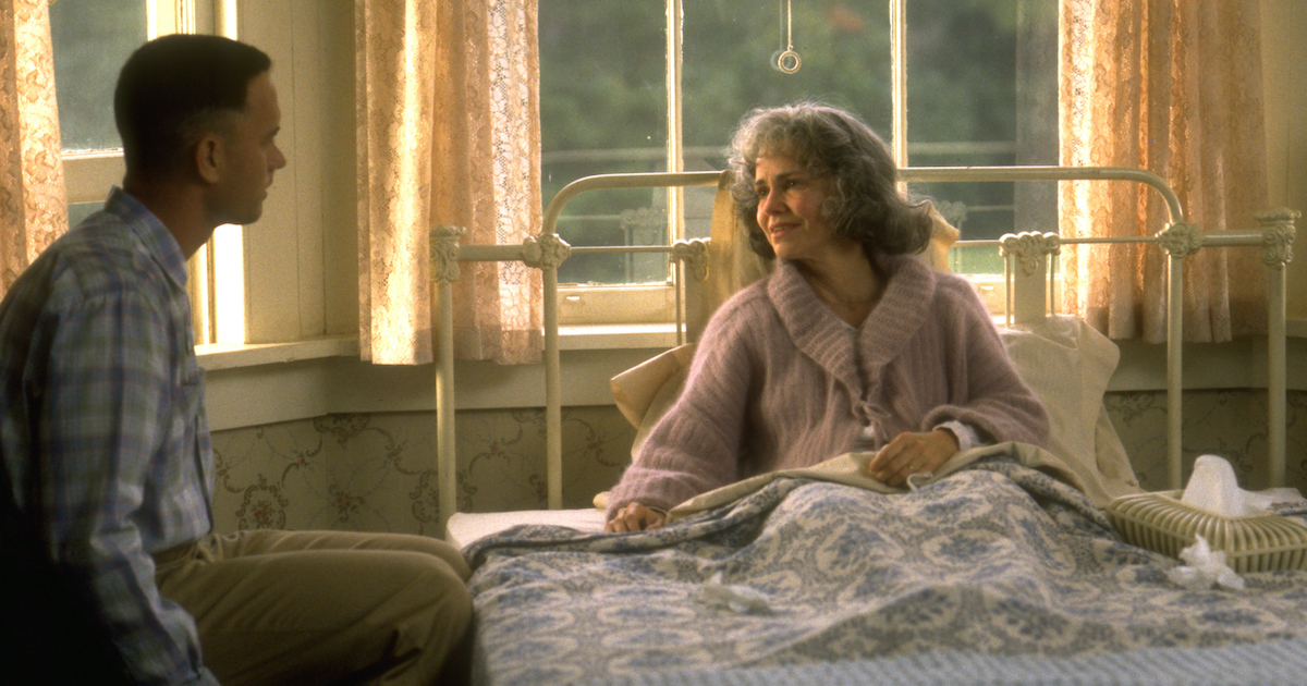 Forrest Gump (Tom Hanks) sits at his mother's (Sally Field) bedside