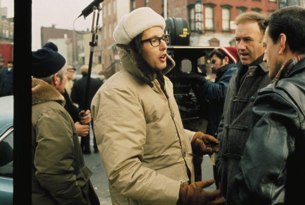 Director William Friedkin speaks with Gene Hackman and Roy Scheider on the set of The French Connection