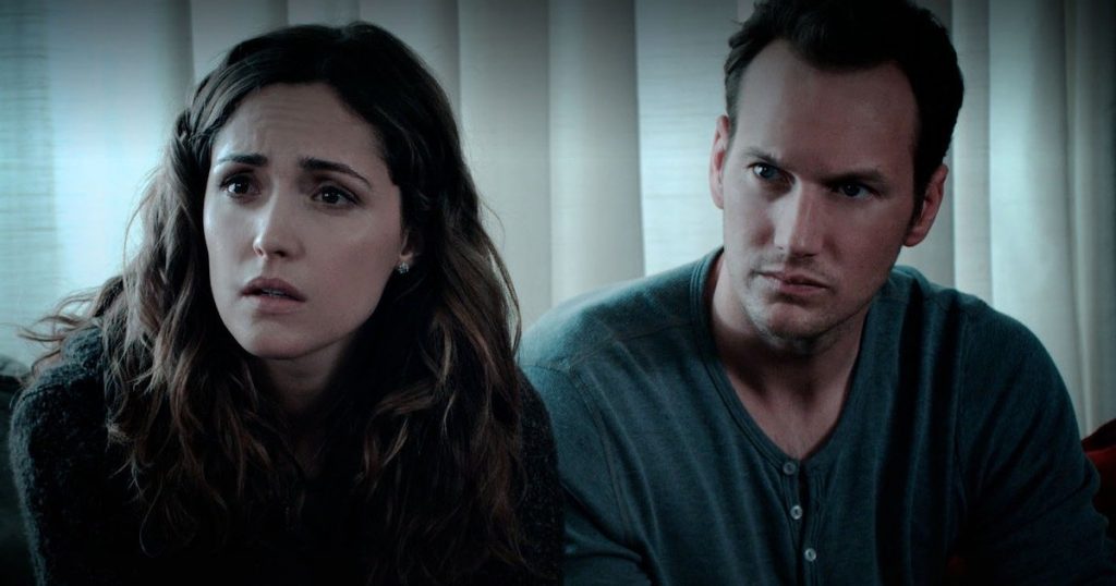 Rose Byrne and Patrick Wilson sit together in Insidious.