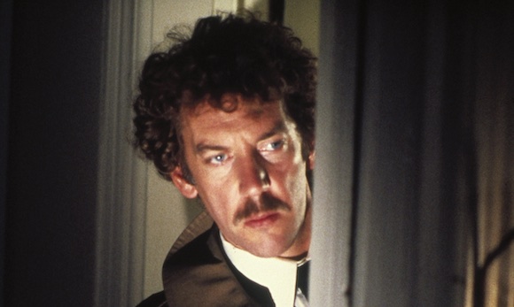 Donald Sutherland peers ominously out of a doorway at night
