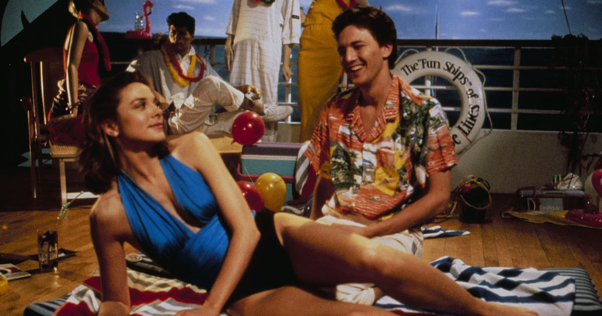 Kim Cattrall and Andrew McCarthy pose in a nautical-themed department store widow in Mannequin (1987)