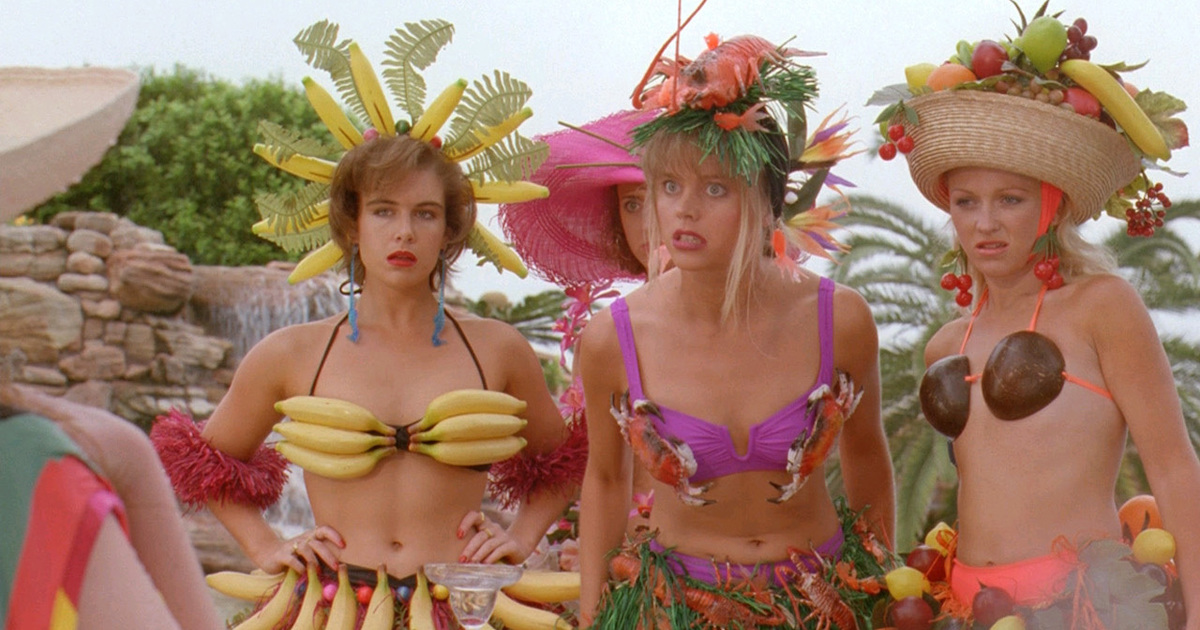 The "snobby girls" in Muriel's wedding wear bikinis adorned with fake fruit and plastic shellfish