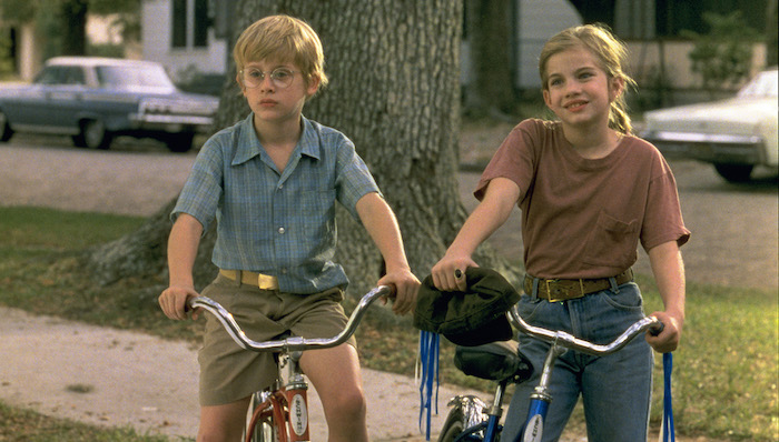 Vada (Anna Chlumsky) and Thomas J. (Macaulay Culkin) ride bikes in My Girl (1991) 