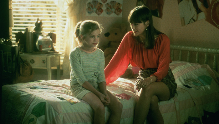 Shelly (Jamie Lee Curtis) gives "the talk" to Vada (Anna Chlumsky) as they sit on the bed in Vada's room in My Girl (1991)