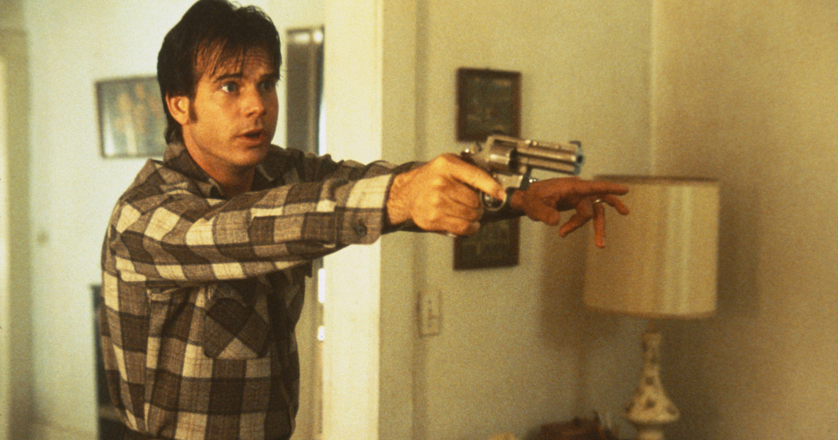 Bill Paxton holds a gun in one false move