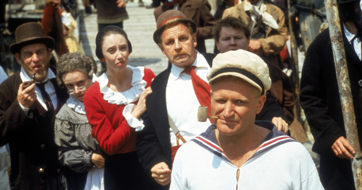 Robin Williams as Popeye in Robert Altman's Popeye with the townsfolk of Sweethaven