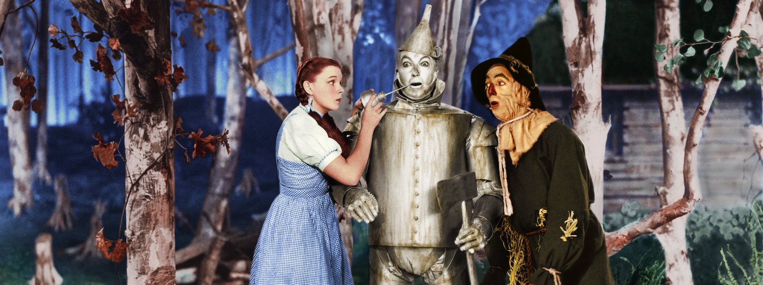 Dorothy and the Scarecrow oil the Tin Man's jaw